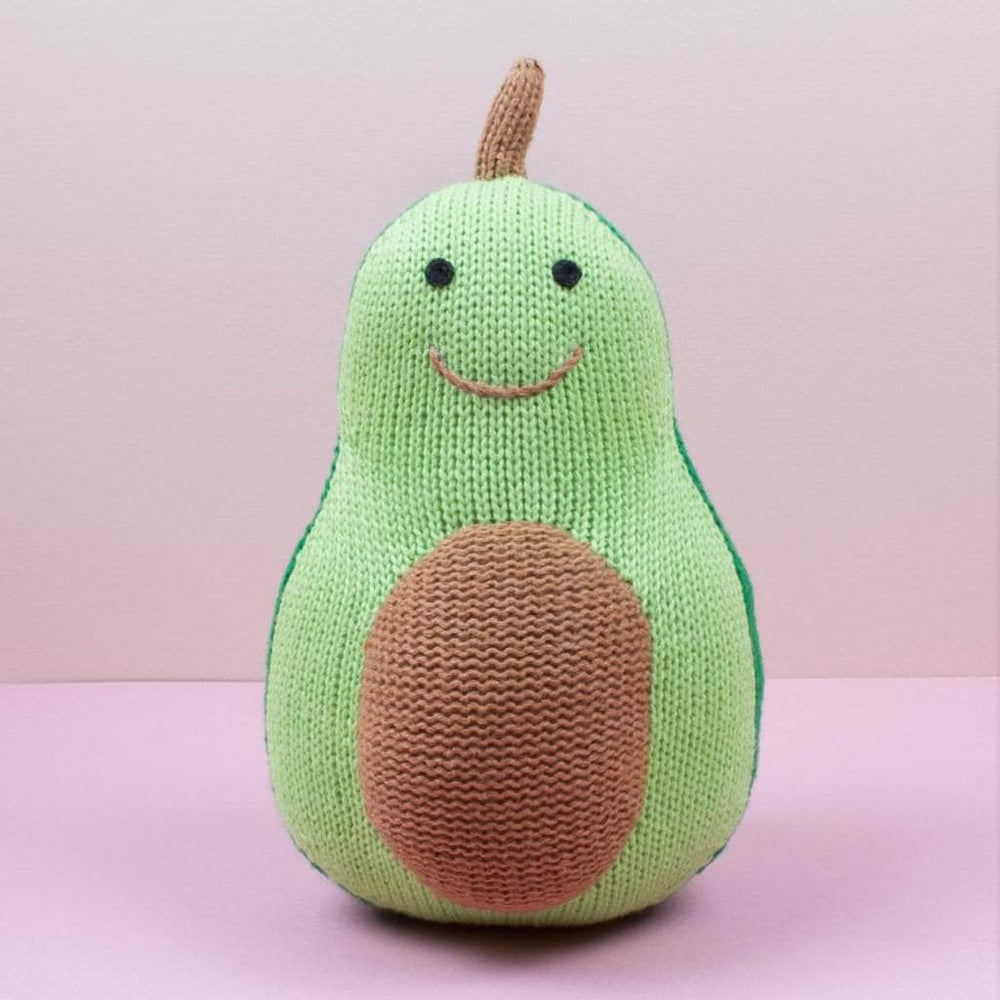Avocado stuffed animal. Knit baby toy with smiling face, brown pit & 2 shades of green body.